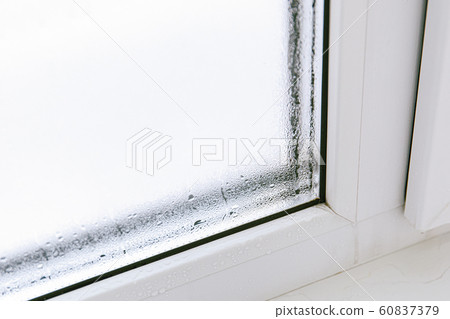 Plastic window with damp and water condensation Plastic window with damp and water condensation 60837379