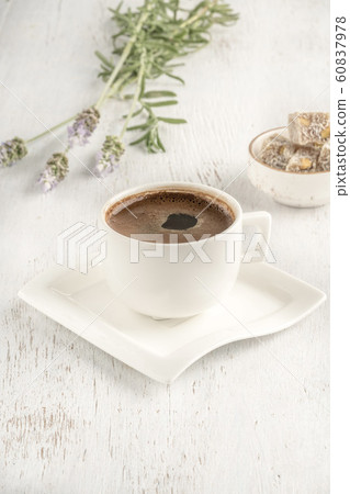 Cup of coffee served with Turkish delight on 60837978