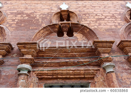 Brick decorative elements around an old window in Brick decorative elements around an old window in 60838868