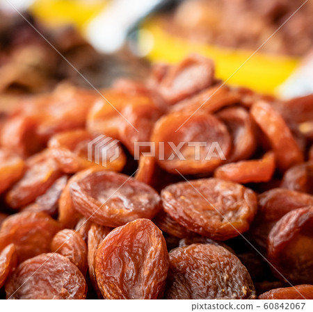 Heap of dried apricots close-up. 60842067