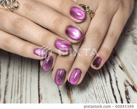 Gray striped nail design on female hand close up. Gray striped nail design on female hand close up. 60843389