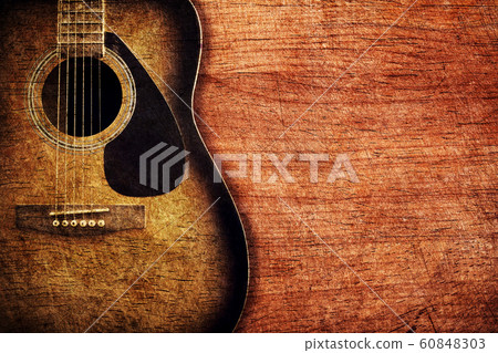 Guitar on wooden background vintage 60848303