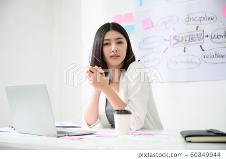 Portrait of beautiful young asian business woman working on computer laptop in office 60849944