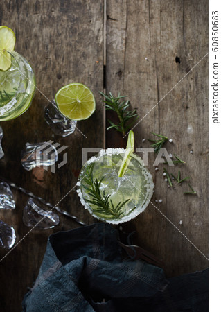 lemonade in glass with rosemary. . 60850683