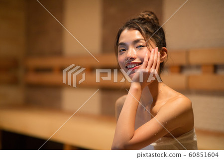 Woman entering the sauna Woman entering the sauna 60851604