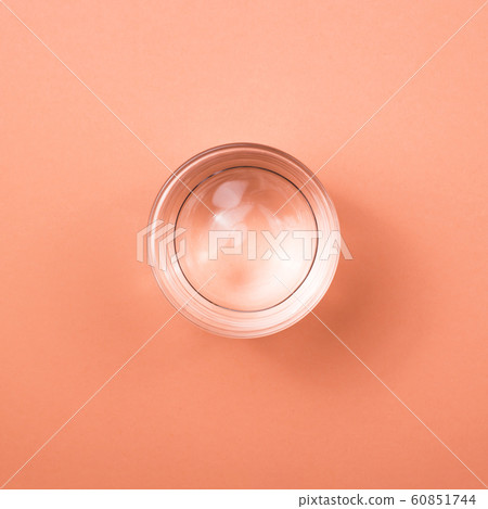 Glass of water on bright background top view. 60851744