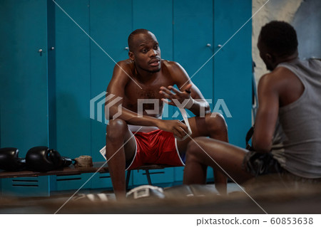 Athletes discussing sports training 60853638