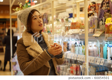 Woman shopping at drugstore 60854501