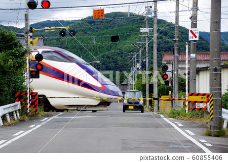 Shinkansen and railroad crossing railroad crossing and train 60855406