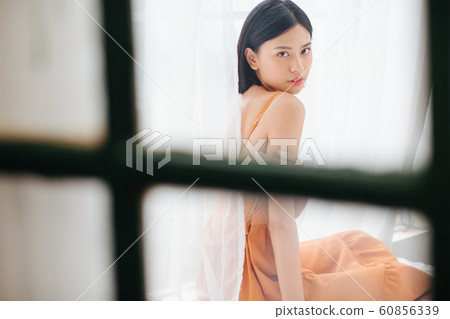 Woman lifestyle window 60856339