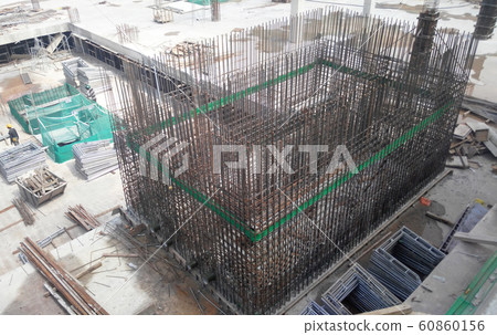 Steel reinforcement bar used to reinforced concrete at the construction site. It was tied together using tiny wires by construction workers.   60860156
