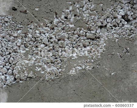 New fresh concrete surface with honeycomb problem and exposing reinforcement bar inside. The problem weakens the concrete strength. . New fresh concrete surface with honeycomb problem and exposing reinforcement bar inside. The problem weakens the concrete strength. . 60860337