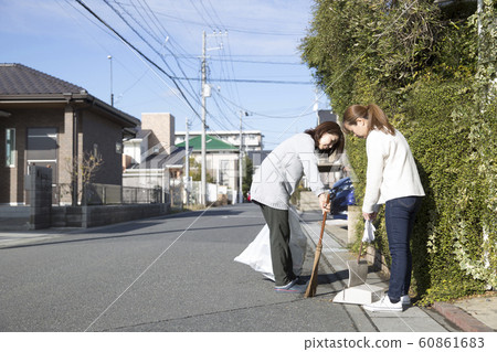 Town cleaning, picking up trash 60861683