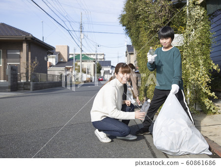 Town cleaning, picking up trash 60861686