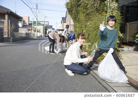 Town cleaning, picking up trash 60861687