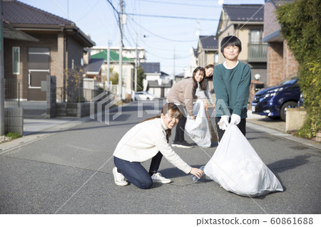 Town cleaning, picking up trash 60861688