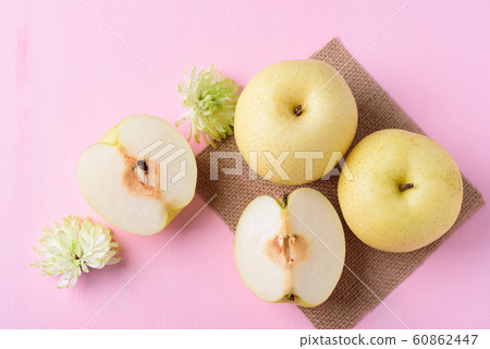 Fresh Asian pear fruit on pink background Fresh Asian pear fruit on pink background 60862447