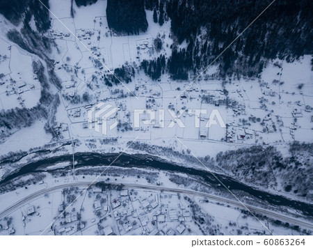 Carpathian village Kryvorivnia covered with snow 60863264