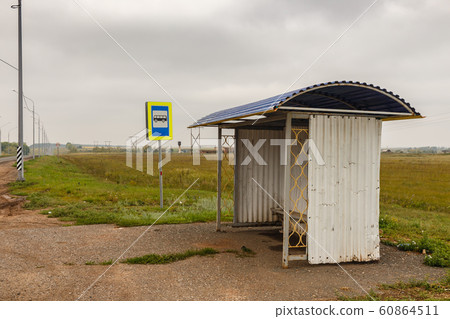 empty bus stop on the road 60864511