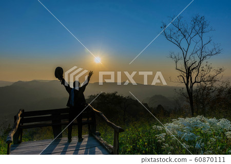 Silhouette sunrise the viewpoint at the mountain in the Phu Pa por at Loei province, Thailand fuji mountain. 60870111