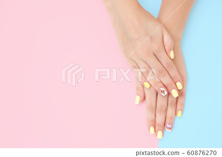 women's hands with a beautiful manicure with 60876270
