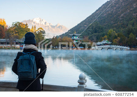 Young woman traveler traveling at Black Dragon 60877254