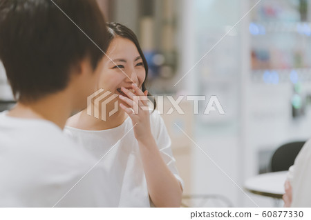 A woman over the mouth 60877330