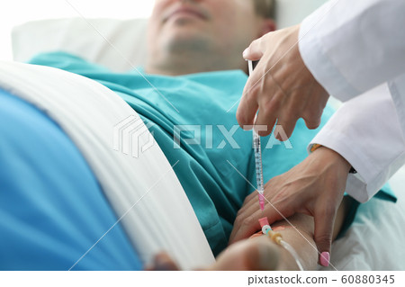 Sick man taking medicament 60880345