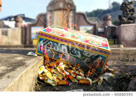 Burn offering paper money and gold to ancestors 60880393
