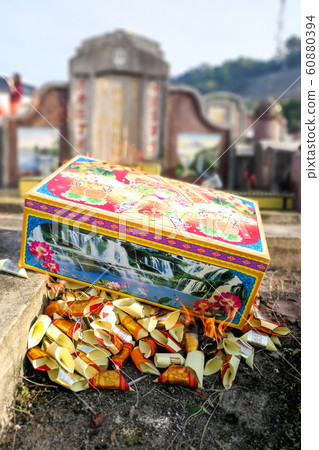 Burn offering paper money and gold to ancestors Burn offering paper money and gold to ancestors 60880394