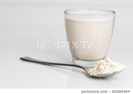 Vanilla flavored protein drinks in glass with Vanilla flavored protein drinks in glass with 60880464