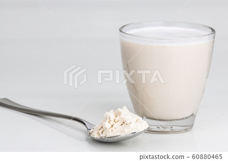 Vanilla flavored protein drinks in glass with Vanilla flavored protein drinks in glass with 60880465