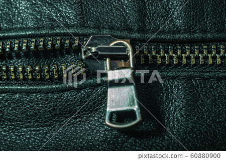 Close up beautiful zipper on natural black leather 60880900