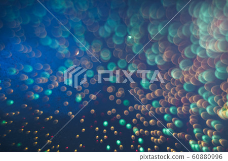 Beautiful bokeh on a sea blue background. Beautiful bokeh on a sea blue background. 60880996