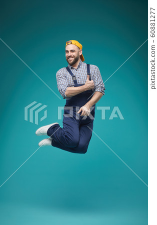 Joyful Worker Jumping Studio Shot Joyful Worker Jumping Studio Shot 60881277