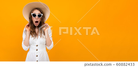 Panorama of beautiful caucasian woman in white suit with big hat and sunglasses smiles isolated on Panorama of beautiful caucasian woman in white suit with big hat and sunglasses smiles isolated on 60882433
