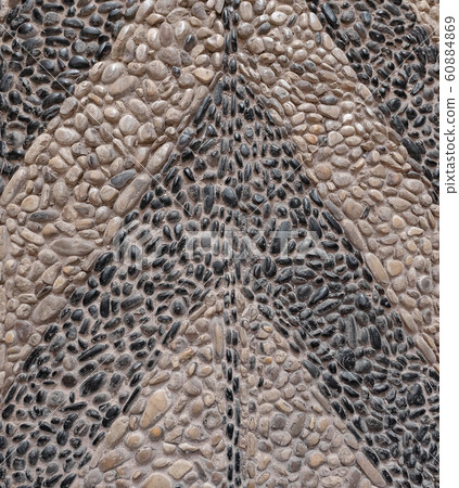 Path with an ancient pattern of pebbles. Texture 60884869