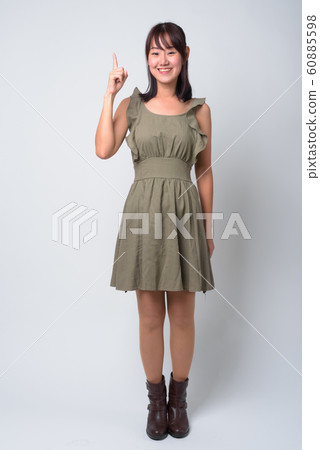 Portrait of beautiful Asian woman against white background Portrait of beautiful Asian woman against white background 60885598