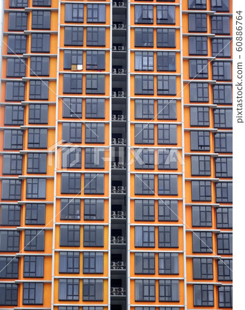 High rise apartment building with modern facade design. Apartment housing popular in the urban areas in Malaysia.  60886764
