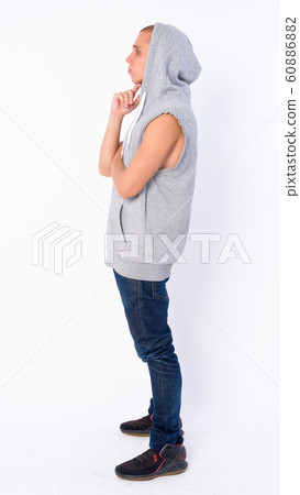 Full body shot profile view of young bald rebellious man thinking 60886882