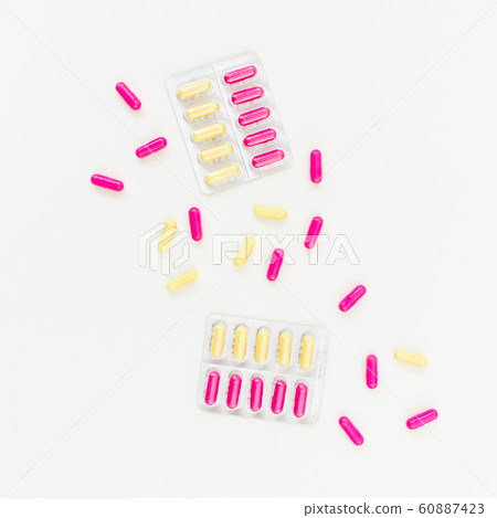 Medical concept with pills of vitamins on white background. Flat lay, top view. Medical concept with pills of vitamins on white background. Flat lay, top view. 60887423
