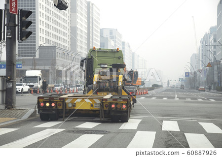 Container vehicle passing through intersection 60887926