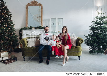 Happy festive family smiling posing at luxury 60890884