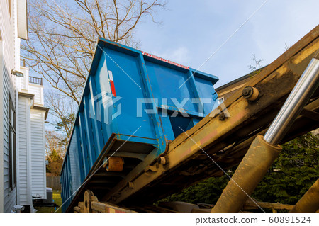 Unloading empty dumpster, recycle waste and 60891524