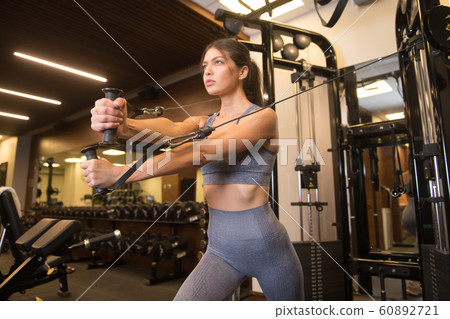 woman doing a workout in the gym woman doing a workout in the gym 60892721