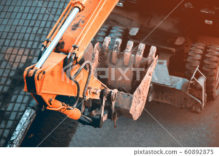 Bucket hydroexcavator in operation Bucket hydroexcavator in operation 60892875