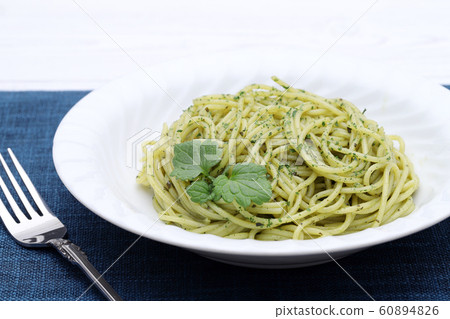 Spaghetti with basil 60894826
