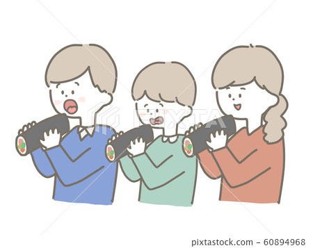 Family eating Ehomaki 60894968