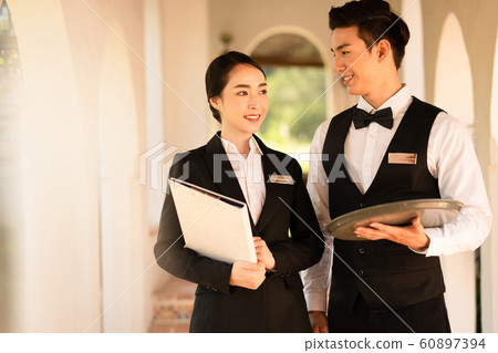 Men and women hotel staff 60897394
