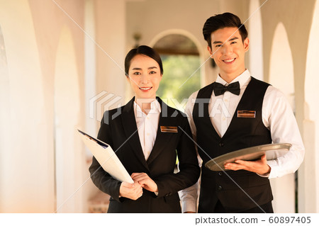 Men and women hotel staff Men and women hotel staff 60897405
